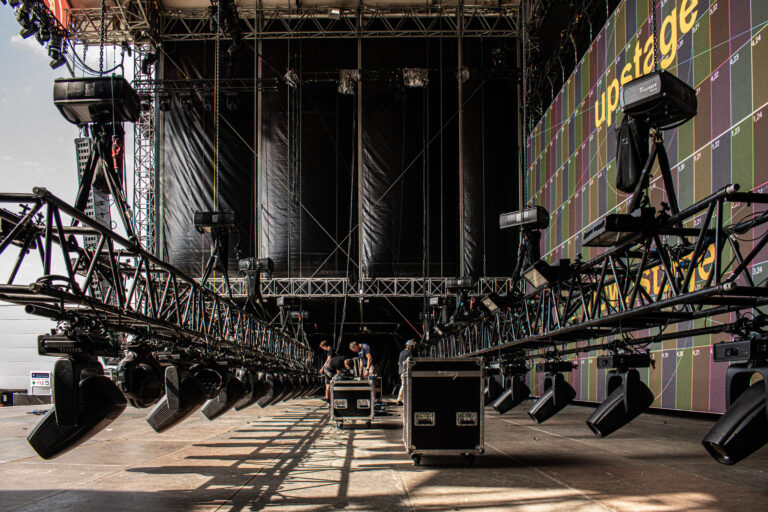 Behind the scenes technical production team managing live event from front of house