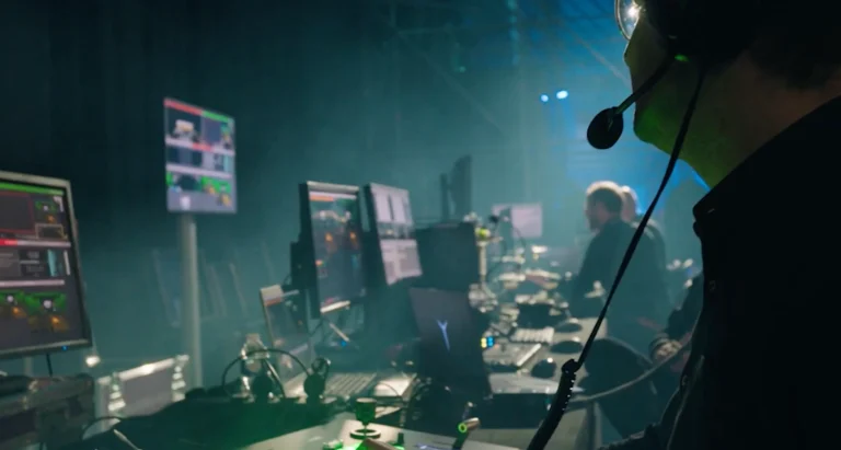 technical production behind the scenes men behind laptops with headsets