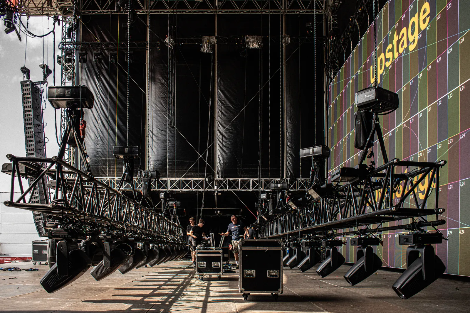 Mainstage lighting rig and LED wall being built at Lux Expo festival by the PRG crew