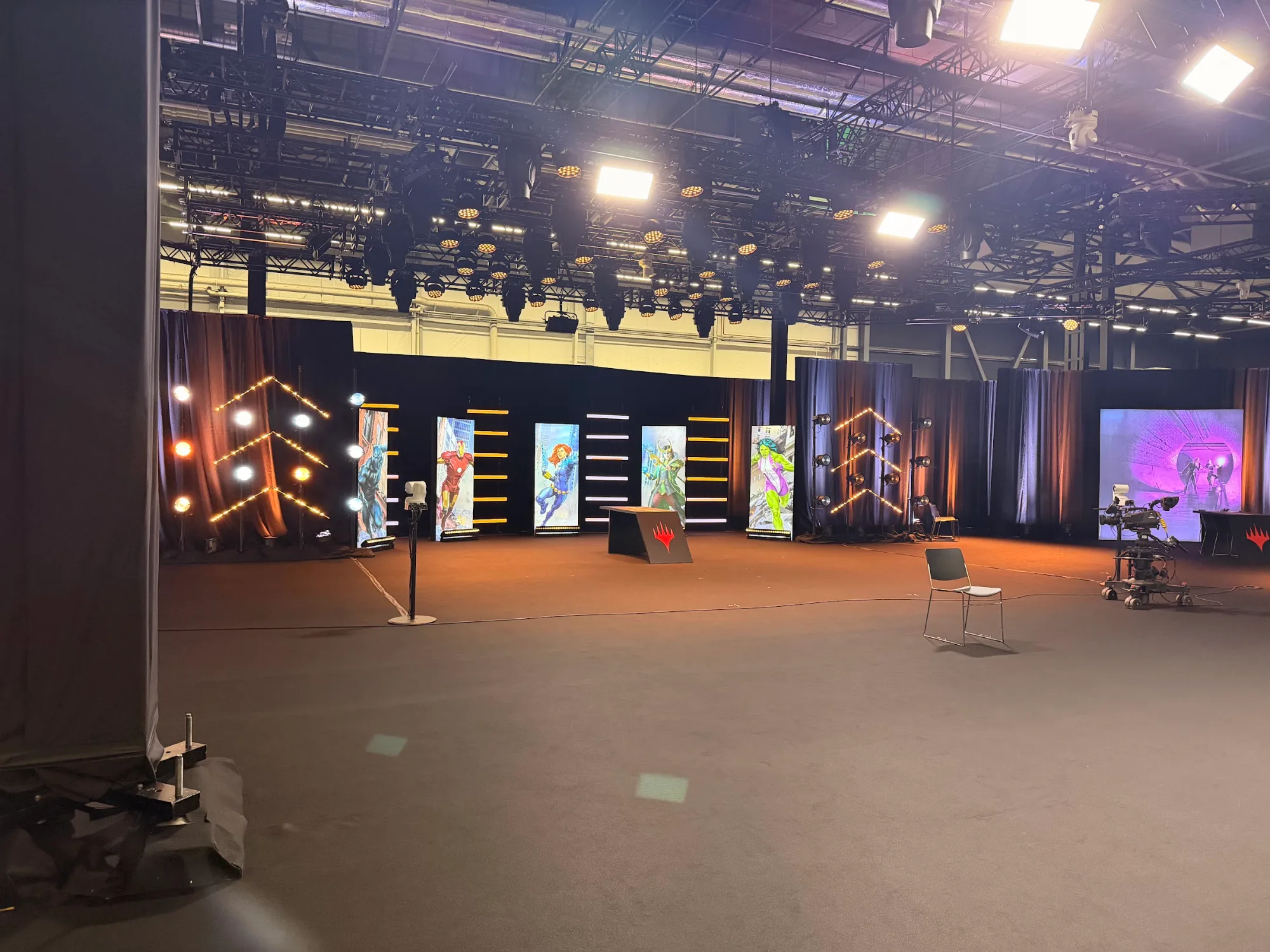 Wide view of the MagicCon 2026 stage with LED screens and truss in RAI Amsterdam