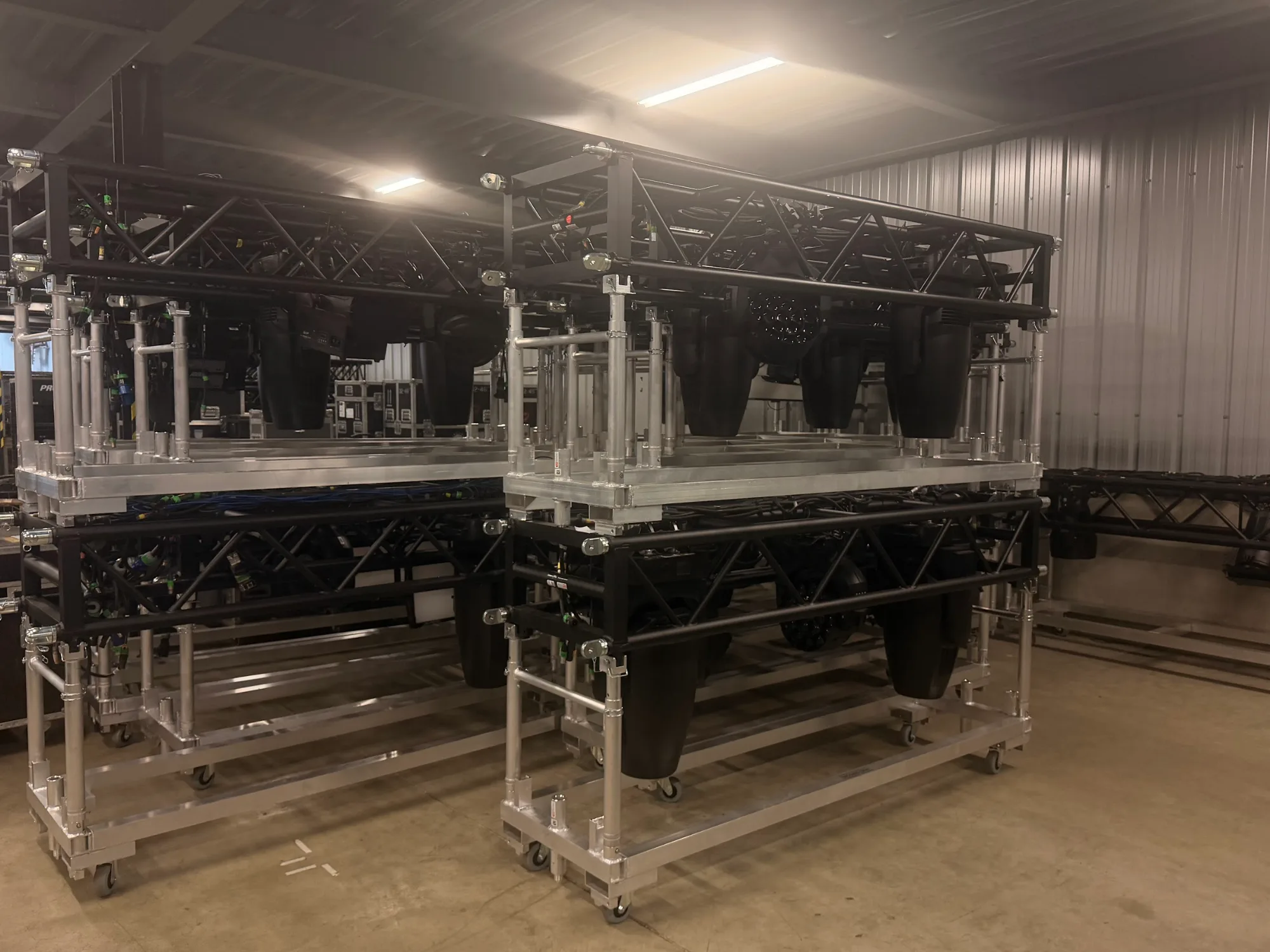 Tour trusses with lighting fixtures pre-rigged in the warehouse before MagicCon 2026